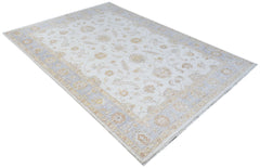 An Afghan Chobi rug featuring a traditional floral pattern in soft beige and light blue tones.