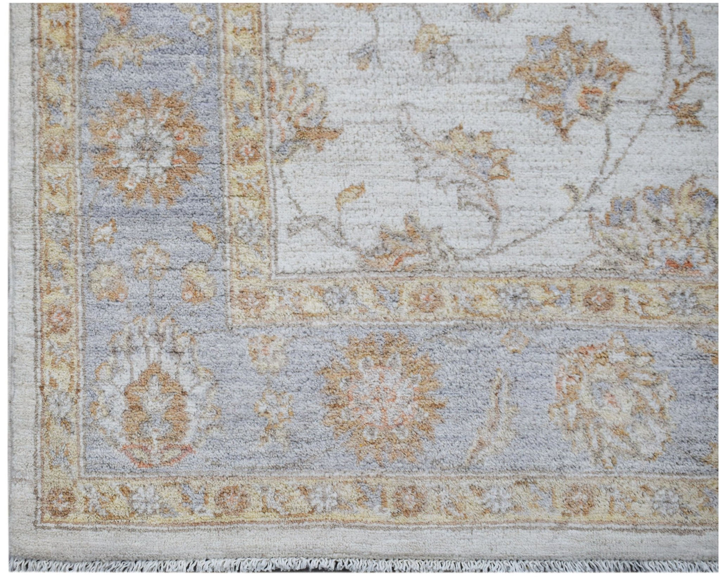 A handmade Afghan Chobi rug featuring a traditional floral pattern in soft beige and blue tones.