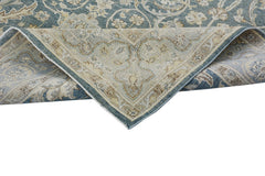 A handmade Afghan Chobi rug featuring a traditional floral pattern in blue and beige tones.