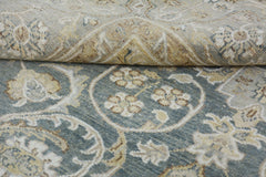 A handmade Afghan Chobi rug featuring a traditional floral pattern in blue and beige tones.