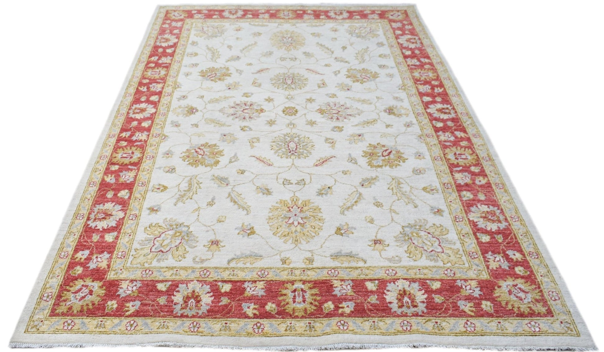 An Afghan Chobi rug featuring a cream field with floral patterns and a wide red border.