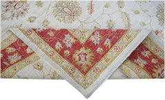 A handwoven Afghan Chobi rug featuring a cream field with floral motifs and a red border.