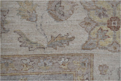 A close-up of a handwoven Afghan Chobi rug featuring traditional floral patterns in earthy tones.