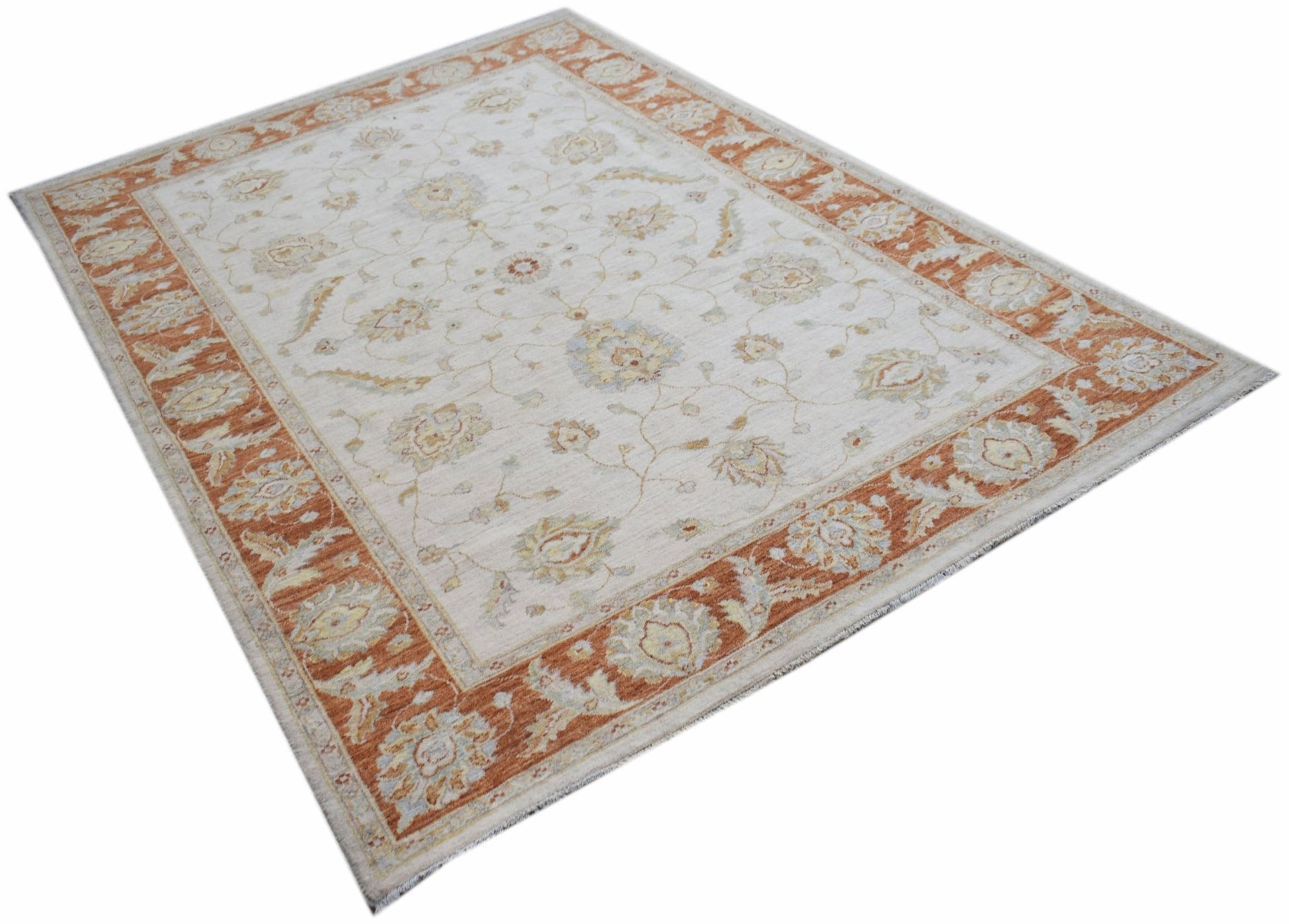 An Afghan Chobi rug featuring a traditional floral pattern in soft orange and cream tones.