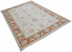 An Afghan Chobi rug featuring a traditional floral pattern in soft orange and cream tones.