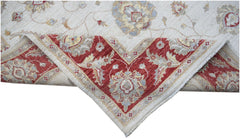 A handwoven Afghan Chobi rug featuring a cream field with floral motifs and a red border.