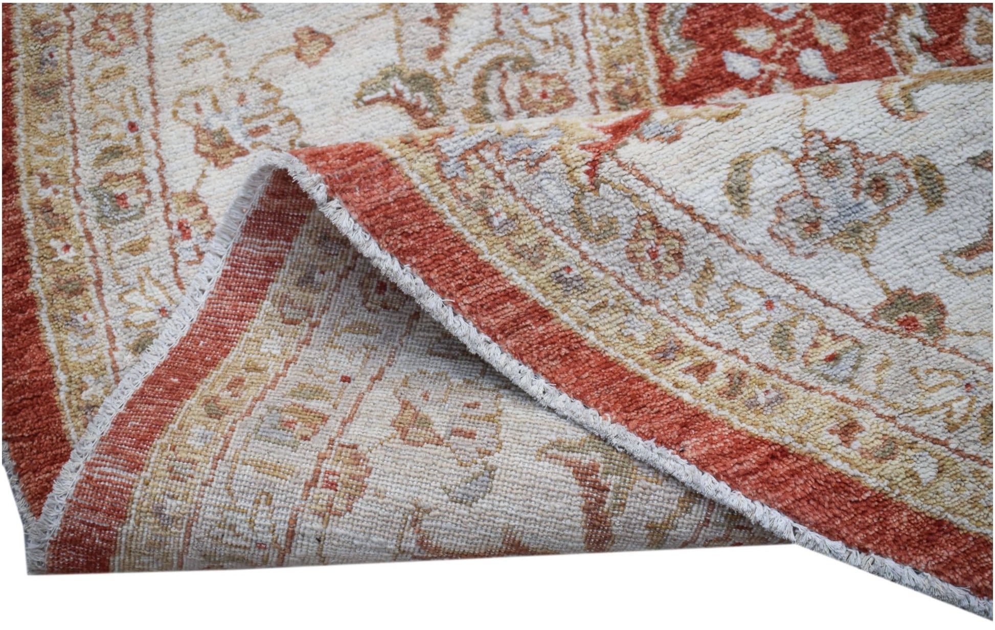 A handwoven Afghan Chobi rug featuring a traditional floral pattern in rust and cream tones.