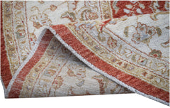 A handwoven Afghan Chobi rug featuring a traditional floral pattern in rust and cream tones.