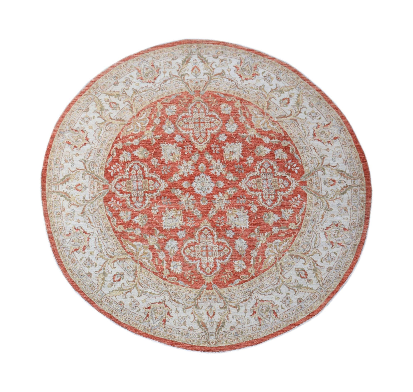 A round Afghan Chobi rug featuring a traditional floral pattern in shades of terracotta and cream.