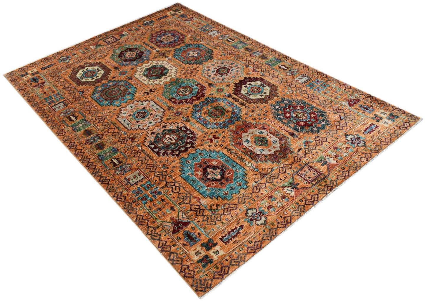 A rectangular Afghan Chobi rug featuring a traditional geometric pattern in warm earthy tones.