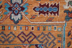 A close-up of a handwoven Afghan Chobi rug featuring intricate floral patterns in warm earth tones.