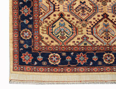 A handmade Afghan Chobi rug featuring a geometric pattern in blue, red, and beige tones.