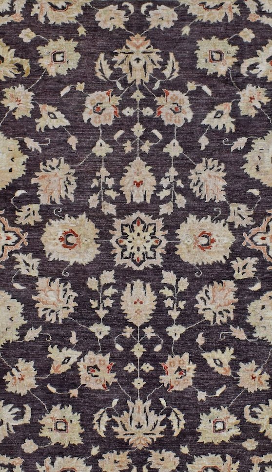 Handwoven Afghan Chobi rug featuring a traditional floral pattern in cream on a dark brown field.