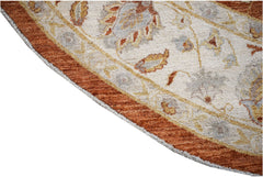 A round Afghan Chobi rug featuring traditional floral patterns in earthy tones on a cream field.