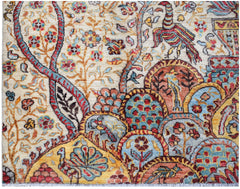 A handwoven Afghan Chobi rug featuring intricate floral patterns and bird motifs in warm tones.