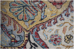 Close-up of a handwoven Afghan Chobi rug featuring intricate floral patterns in earthy tones.