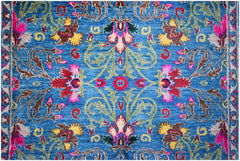 A handwoven Afghan Chobi rug featuring a vibrant blue field with intricate floral patterns.