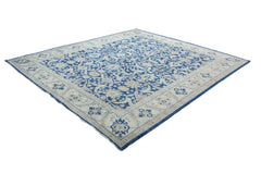 A square Afghan Chobi rug featuring a traditional blue and cream floral pattern.