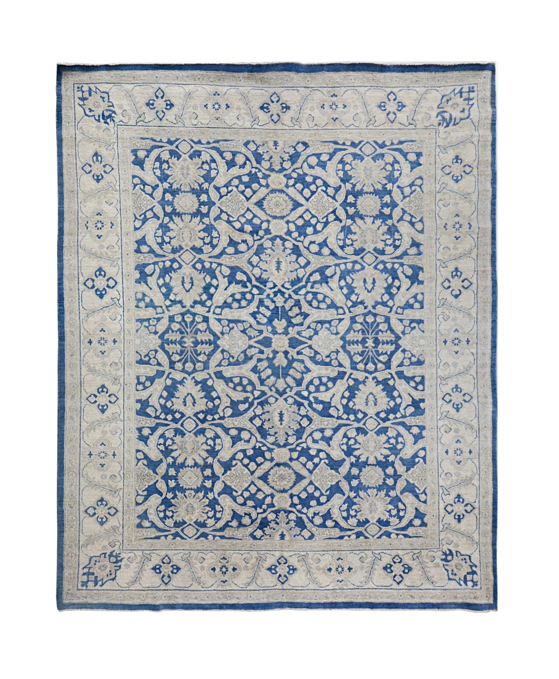 Handmade Afghan Chobi rug featuring a traditional blue and cream floral pattern.