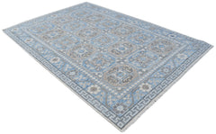 A rectangular Afghan Chobi rug featuring a blue and beige geometric pattern with a fringed edge.