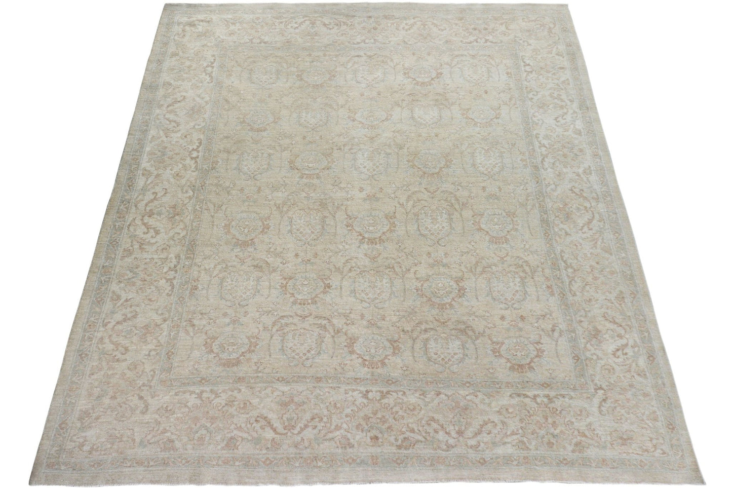 A handmade Afghan Chobi rug featuring a traditional floral pattern in soft beige and wood tones.