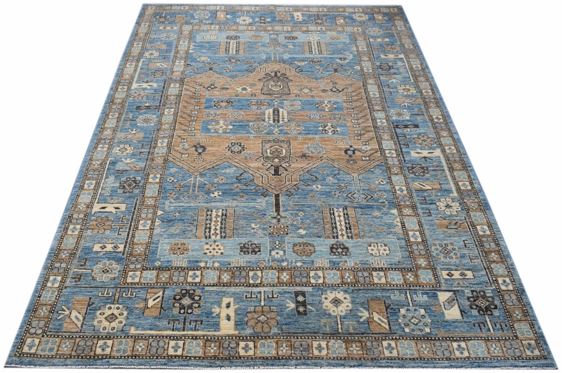 Handwoven Afghan Chobi rug featuring a traditional geometric pattern in blue and tan tones.