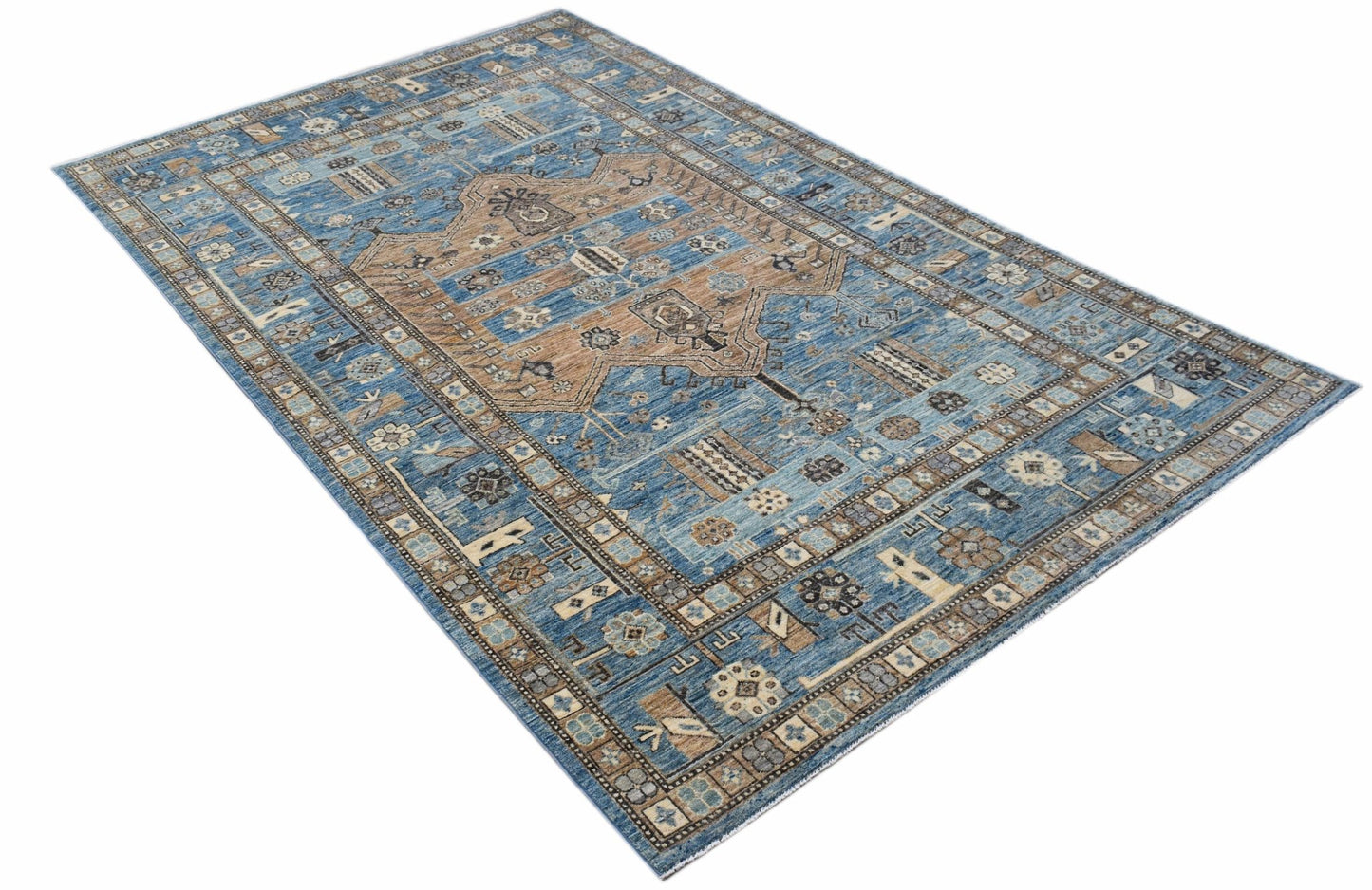 A rectangular Afghan Chobi rug featuring a traditional blue and tan geometric pattern.