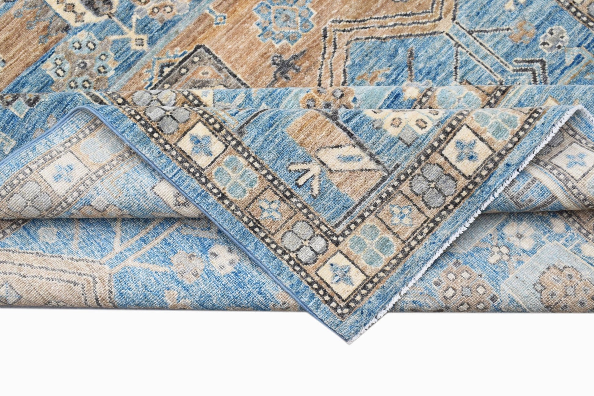 A handwoven Afghan Chobi rug featuring traditional geometric patterns in blue and tan tones.