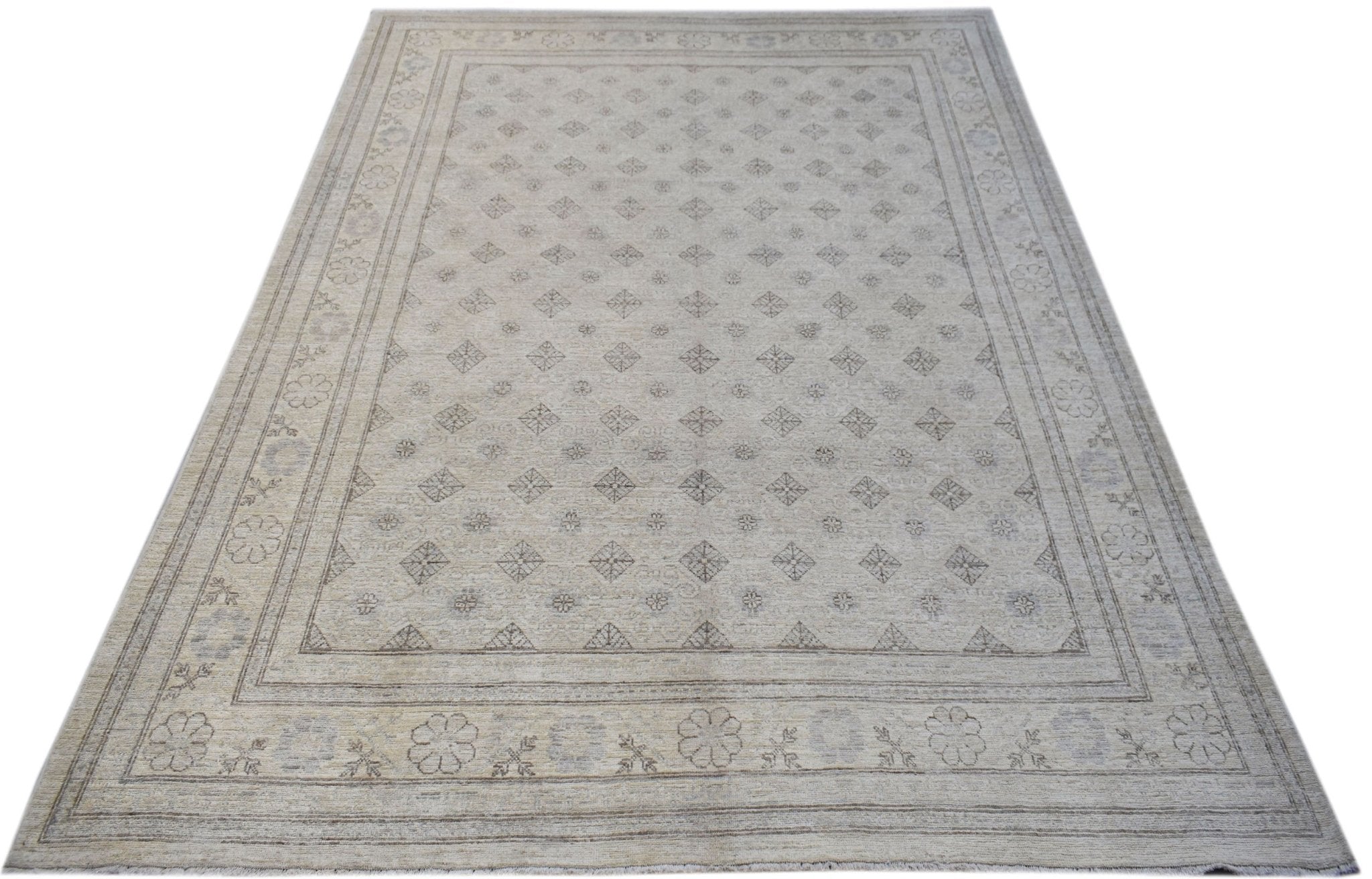 A rectangular Afghan Chobi rug featuring a light beige field with a repeating diamond pattern.