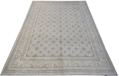 A rectangular Afghan Chobi rug featuring a light beige field with a repeating diamond pattern.