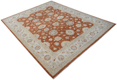 A rectangular Afghan Chobi rug featuring a floral pattern in rust orange and cream tones.
