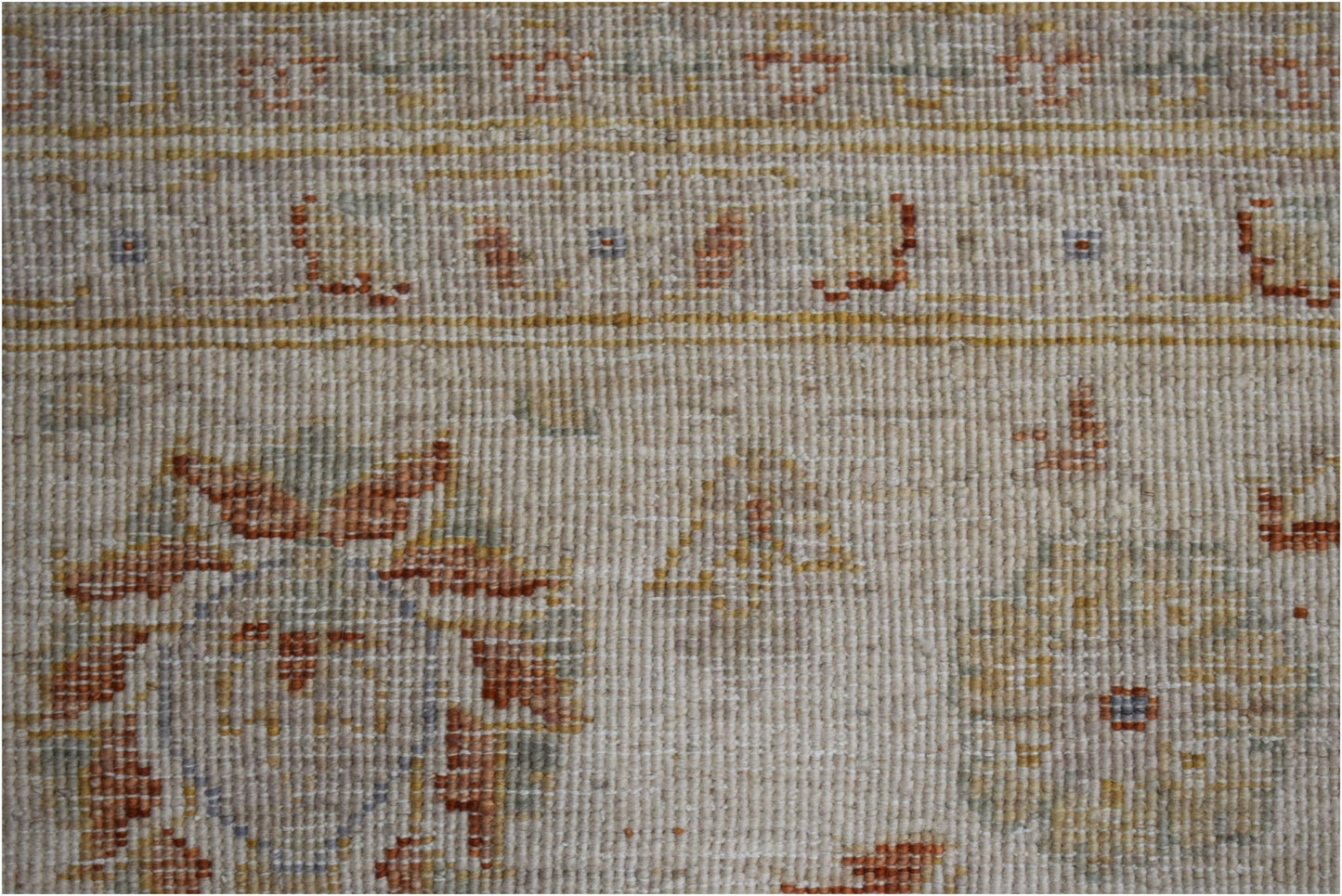 A handmade Afghan Chobi rug featuring a traditional floral pattern in soft, earthy wood tones.