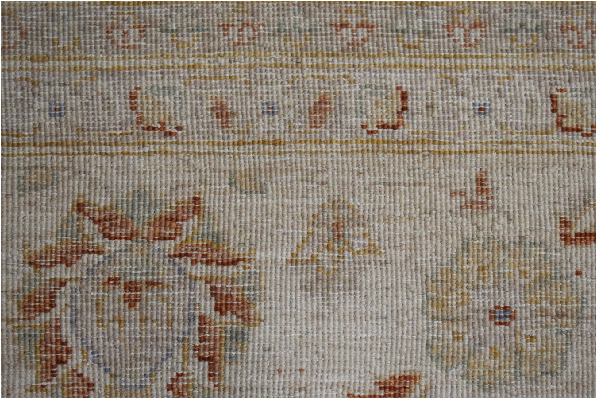 A handmade Afghan Chobi rug featuring a traditional floral pattern in soft, earthy wood tones.