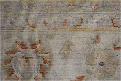 A handmade Afghan Chobi rug featuring a traditional floral pattern in soft, earthy wood tones.