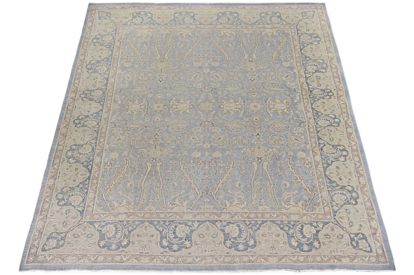 A handmade Afghan Chobi rug featuring a traditional floral pattern in shades of blue and beige.
