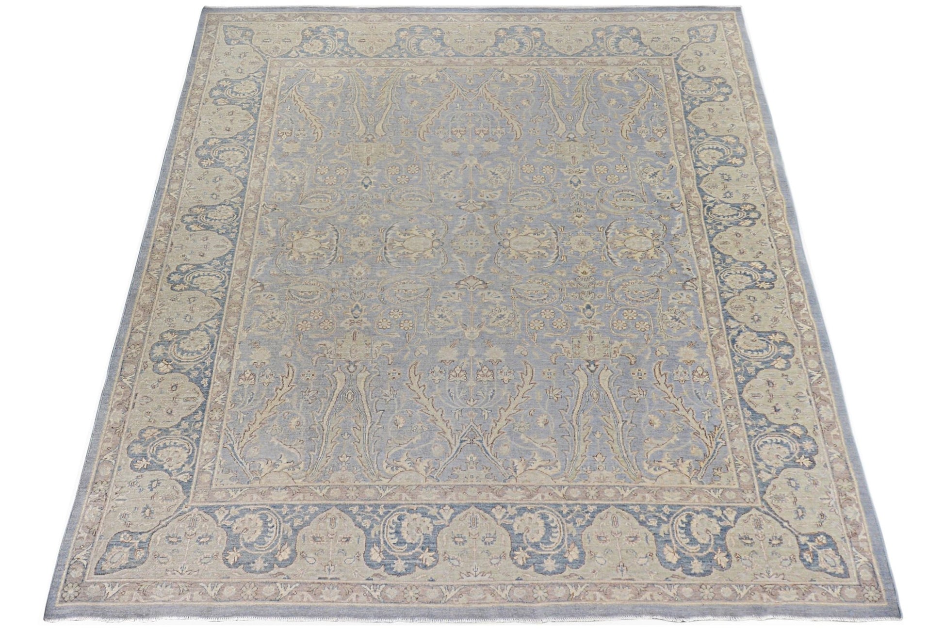A handmade Afghan Chobi rug featuring a traditional floral pattern in shades of blue and beige.