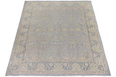 A handmade Afghan Chobi rug featuring a traditional floral pattern in shades of blue and beige.