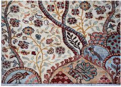 A handwoven Afghan Chobi rug featuring intricate floral patterns and birds in earthy tones.