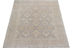 A handmade Afghan Chobi rug featuring a traditional floral pattern in soft beige and grey tones.