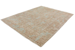 A handmade Afghan Chobi rug featuring a traditional floral pattern in shades of beige and blue.
