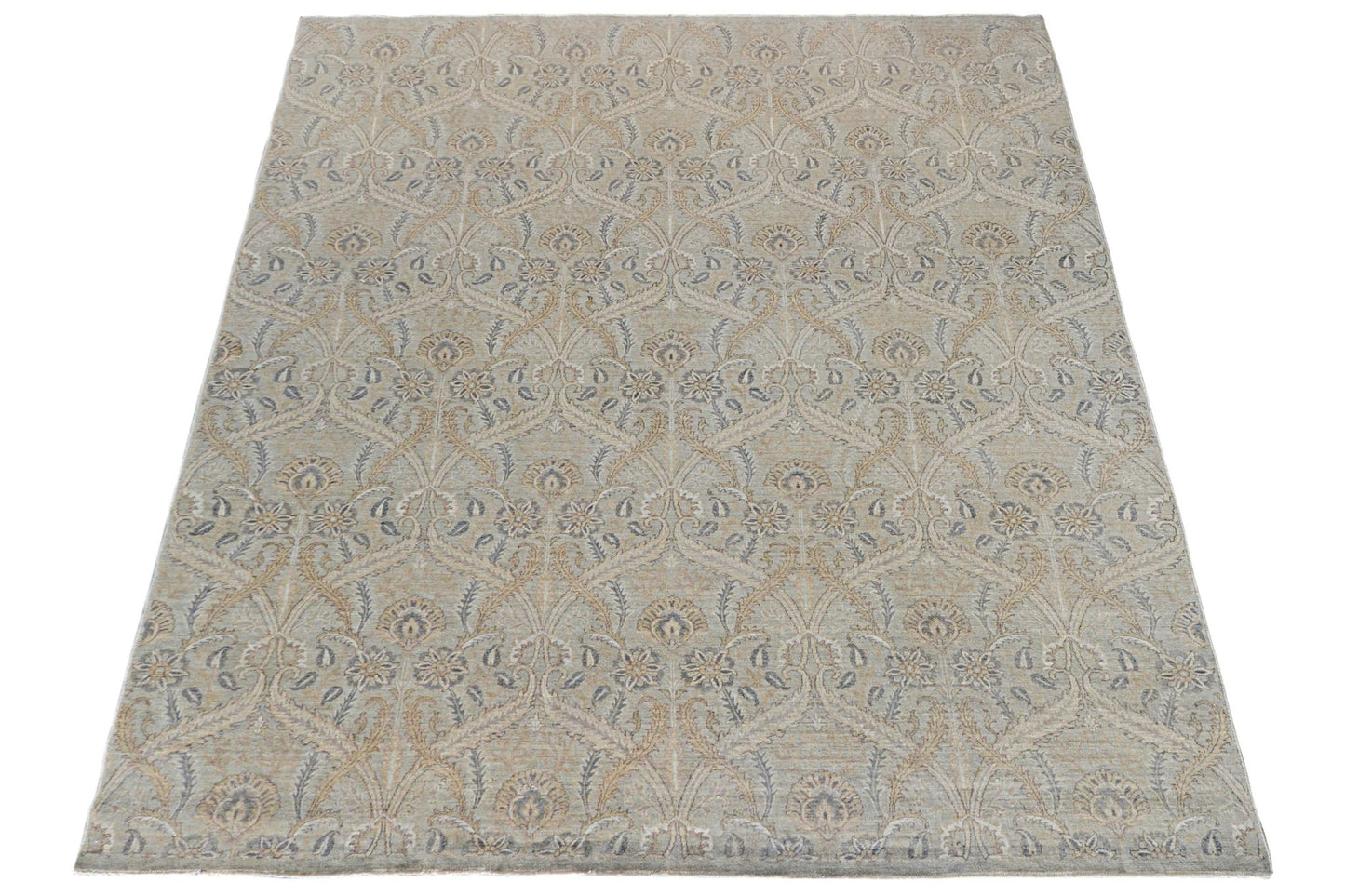 Handmade Afghan Chobi rug featuring a traditional floral pattern in soft beige and blue tones.