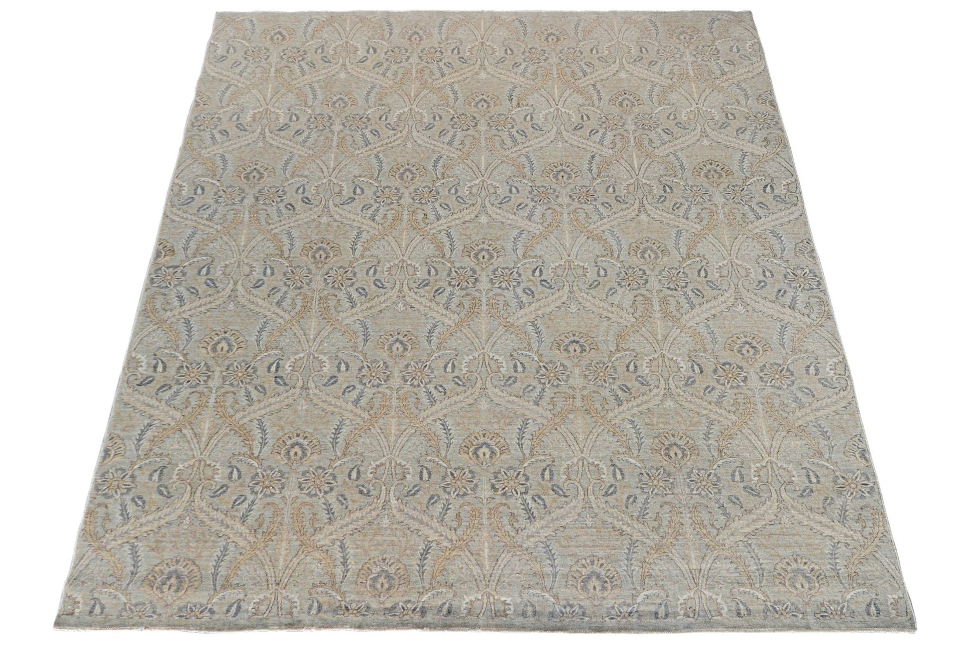 Handmade Afghan Chobi rug featuring a traditional floral pattern in soft beige and blue tones.