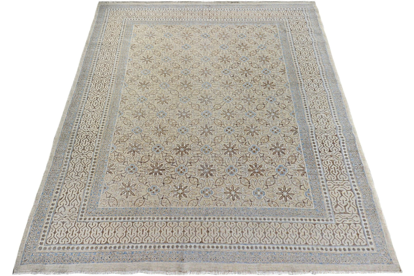 An Afghan Chobi rug featuring a repeating floral pattern in soft beige and blue tones.