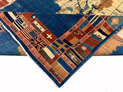A handmade Afghan Chobi rug featuring a world map design with a border of international flags.