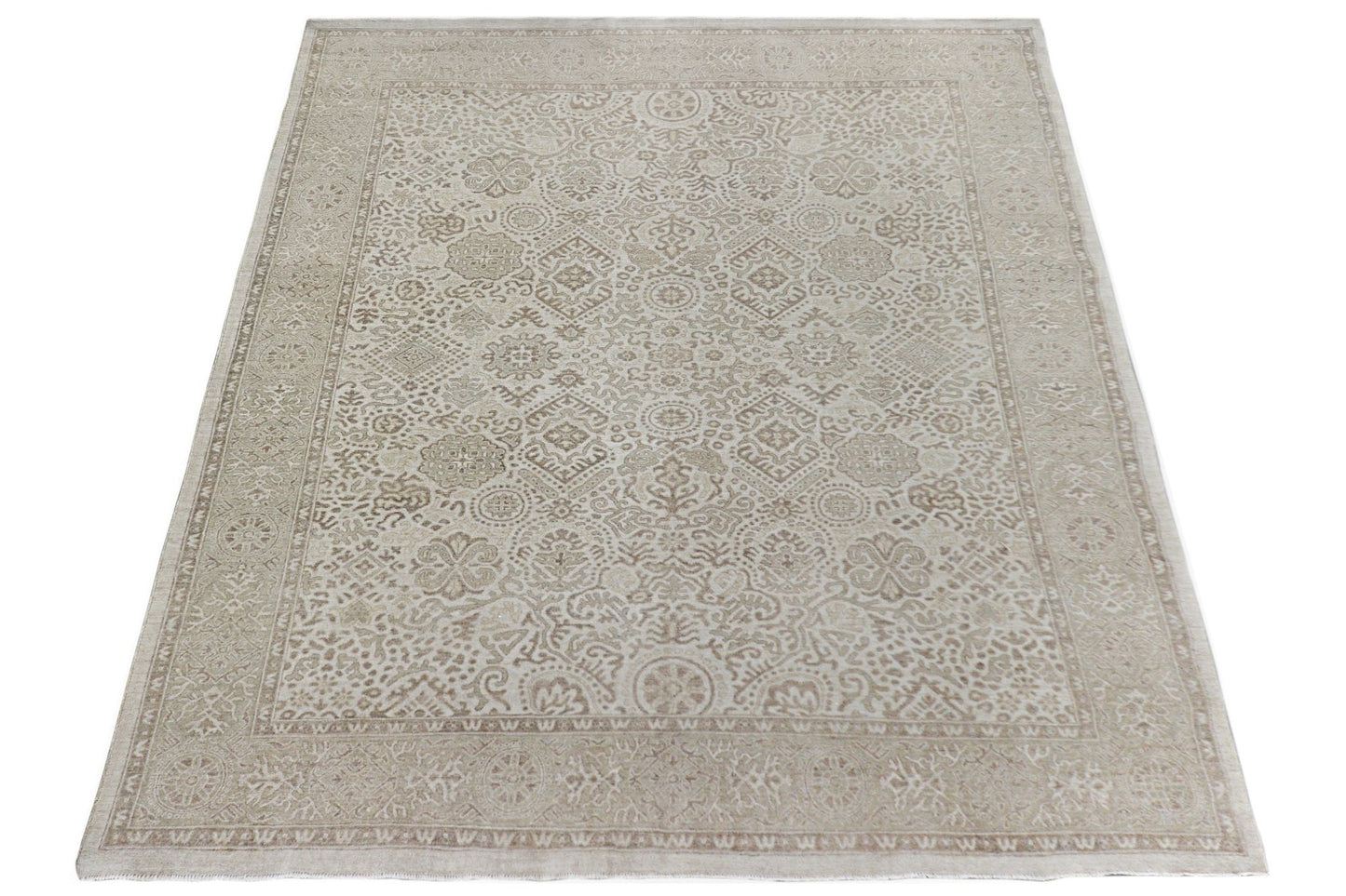 A handmade Afghan Chobi rug featuring a traditional beige and cream floral pattern.