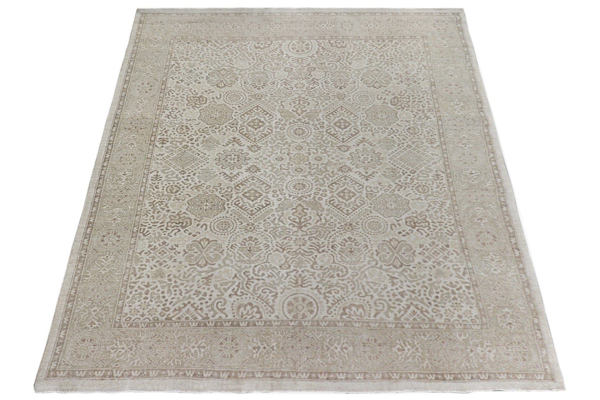 A handmade Afghan Chobi rug featuring a traditional beige and cream floral pattern.