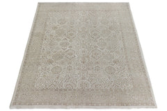 A handmade Afghan Chobi rug featuring a traditional beige and cream floral pattern.
