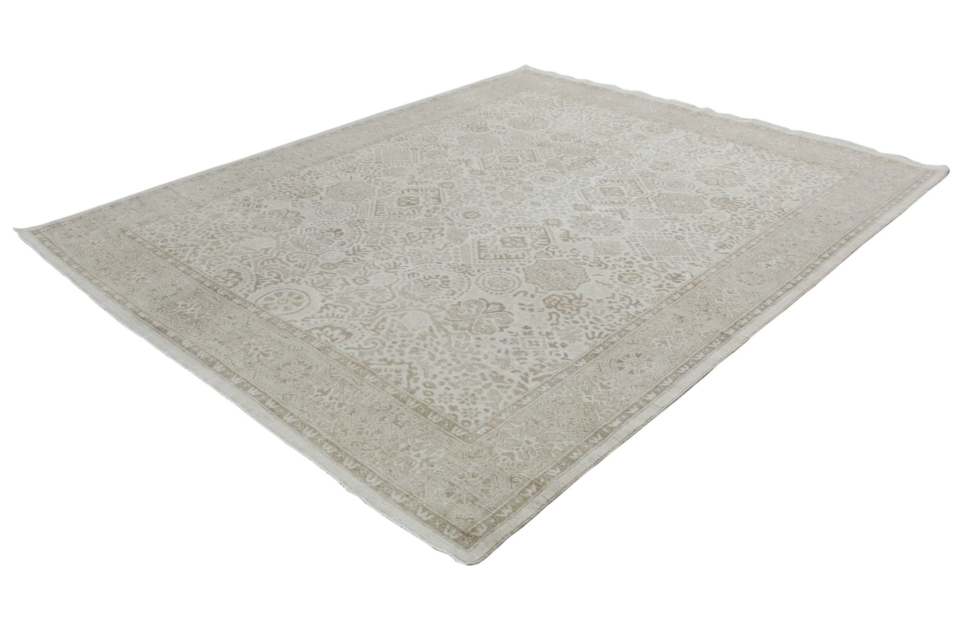 An Afghan Chobi rug featuring a traditional beige and cream patterned design in handspun wool.