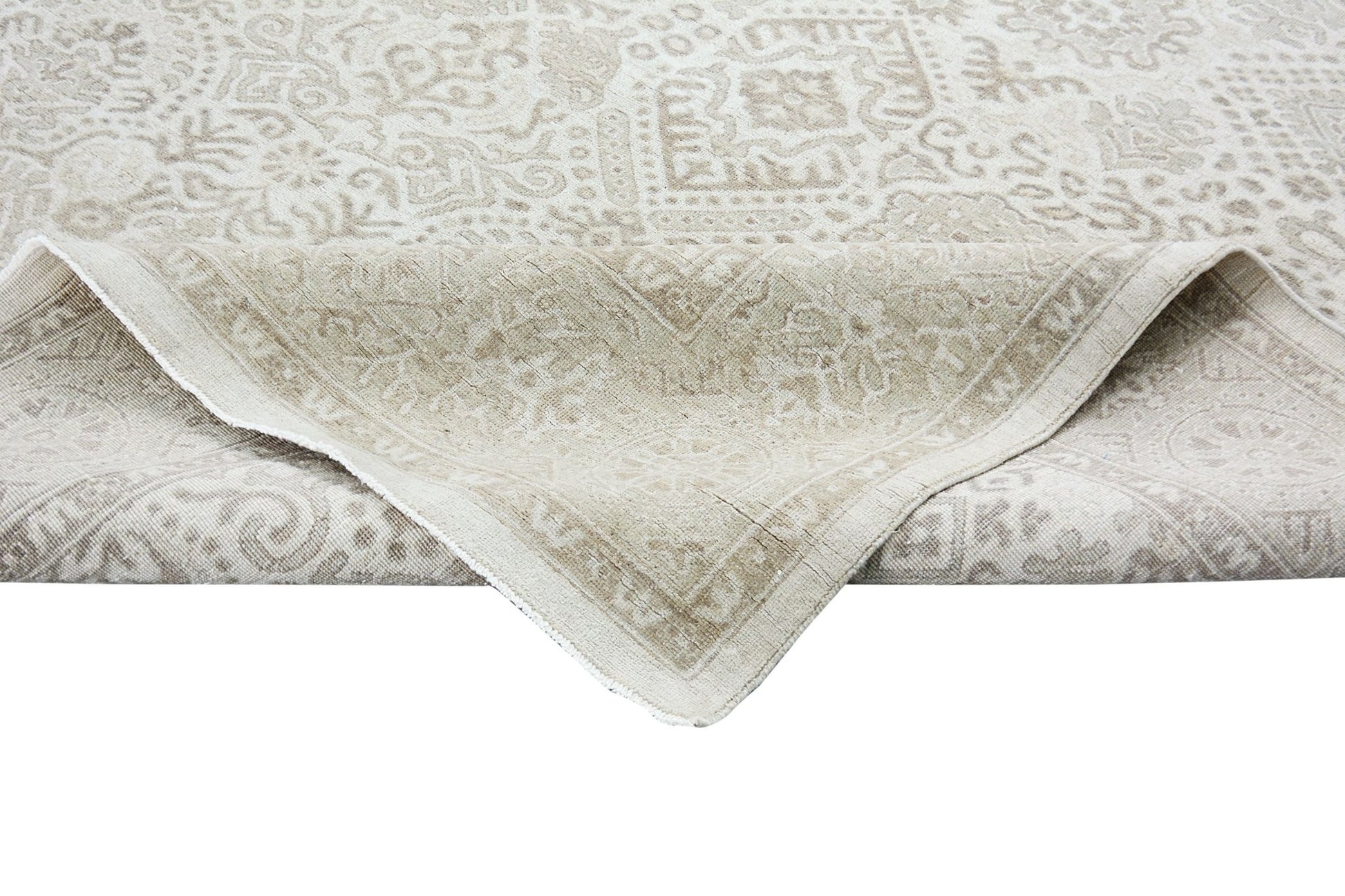 A handmade Afghan Chobi rug with a traditional beige and cream patterned design.
