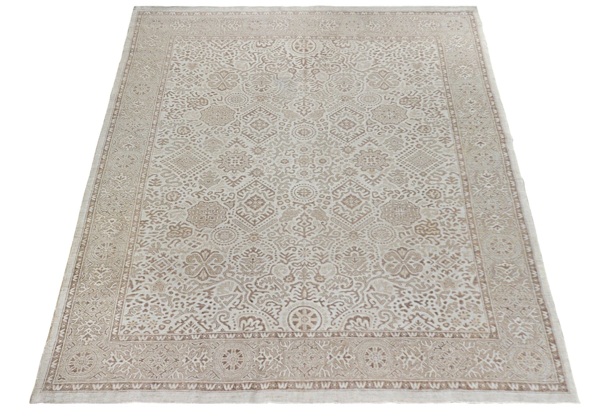 An Afghan Chobi rug featuring a traditional beige and brown geometric pattern.